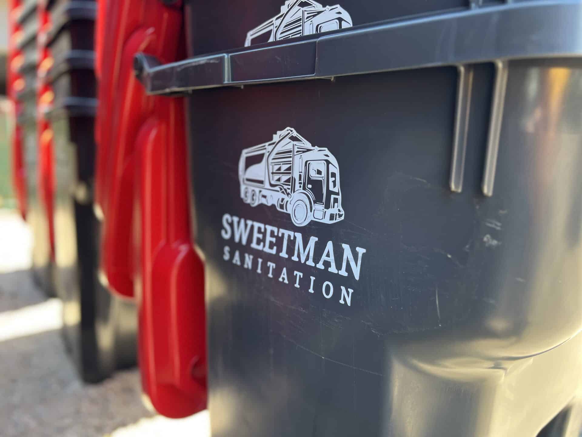Sweetman Sanitation Logo on Trash Cart